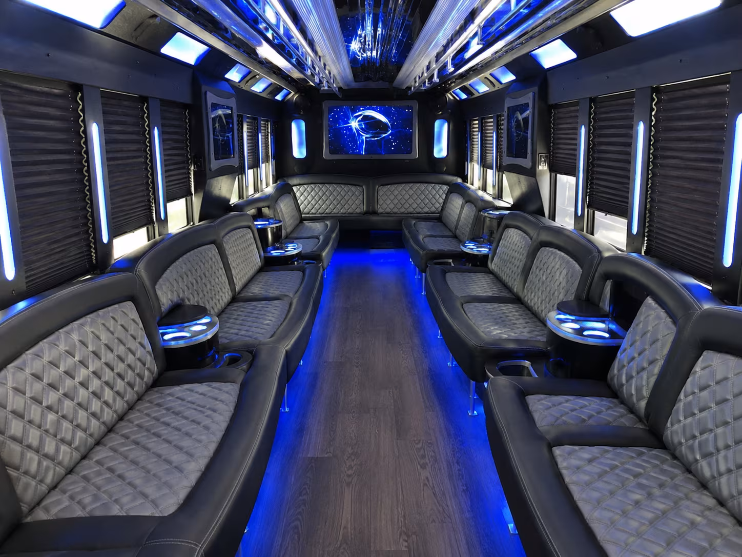 Wedding guests seated inside a party bus serving Orange